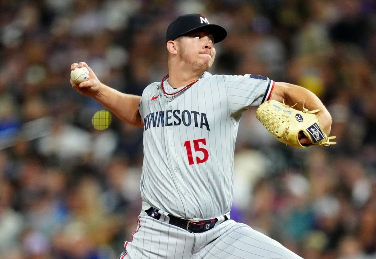 Sep 29, 2023; Denver, Colorado, USA; Minnesota Twins relief pitcher Emilio Pagan (15) delivers a pitch in the ninth inning against the Colorado Rockies at Coors Field.