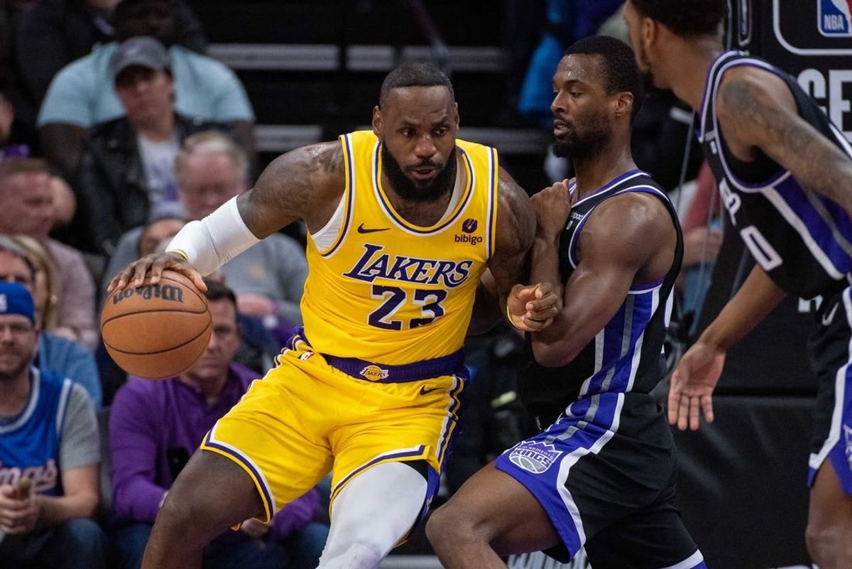 Mar 13, 2024; Sacramento, California, USA; Sacramento Kings forward Harrison Barnes (40) defends against Los Angeles Lakers forward LeBron James (23) during the fourth quarter at Golden 1 Center.