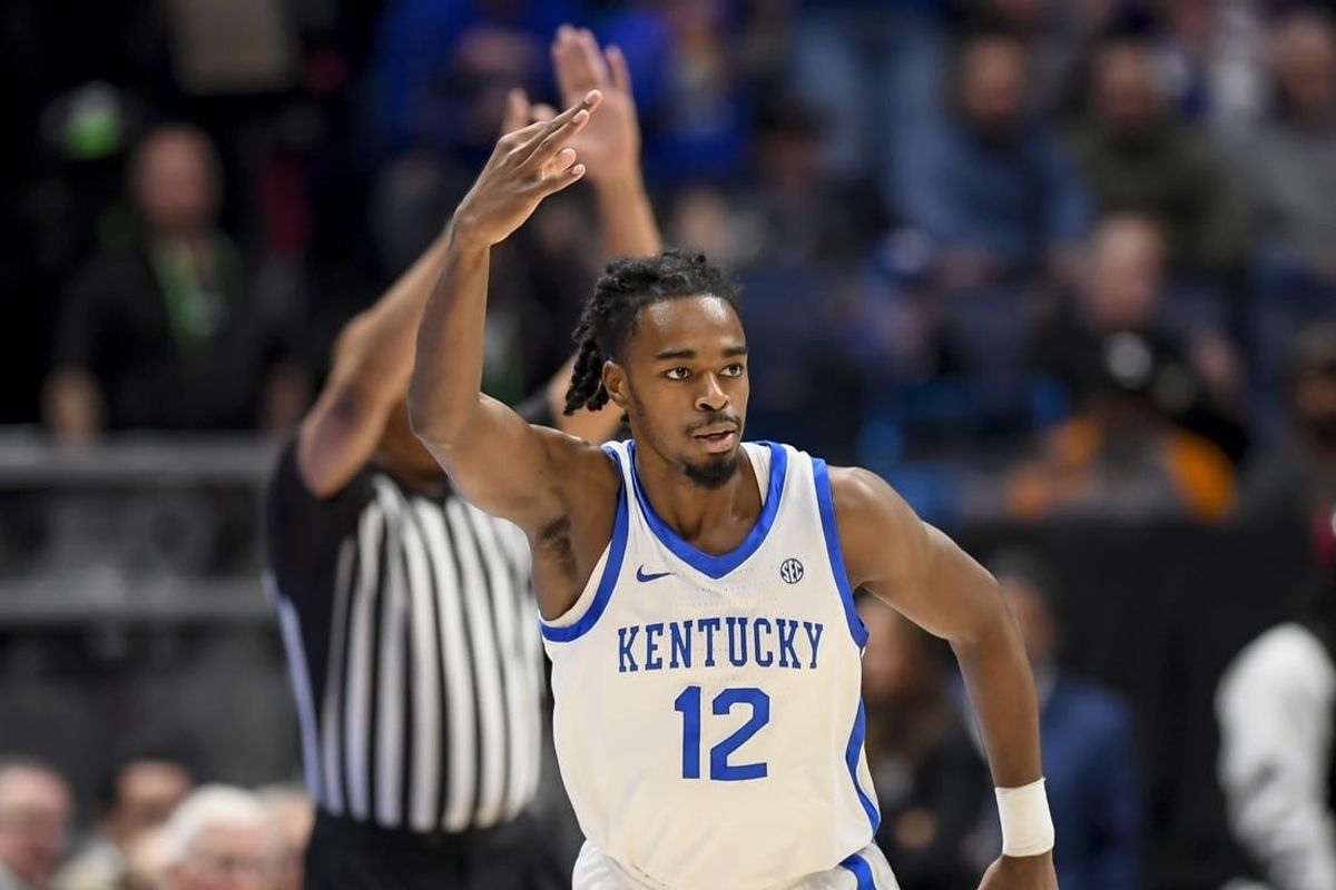 Mar 15, 2024; Nashville, TN, USA; Kentucky Wildcats guard Antonio Reeves (12) celebrates his three point basket against the Texas A&M Aggies during the first half at Bridgestone Arena.