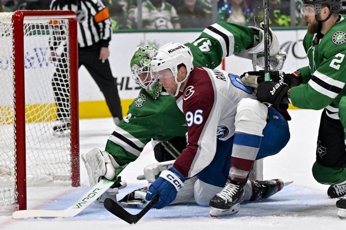 Jan 4, 2024; Dallas, Texas, USA; Dallas Stars goaltender Scott Wedgewood (41) stops a shot by Colorado Avalanche right wing Mikko Rantanen (96) during the first period at the American Airlines Center.