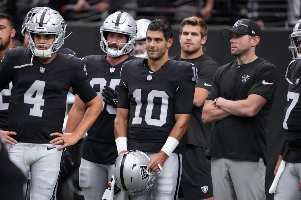Aug 13, 2023; Paradise, Nevada, USA; Las Vegas Raiders quarterback Jimmy Garoppolo (10) and quarterback Aidan O'Connell (4) watch from the sidelines against the San Francisco 49ers in the first half at Allegiant Stadium.
