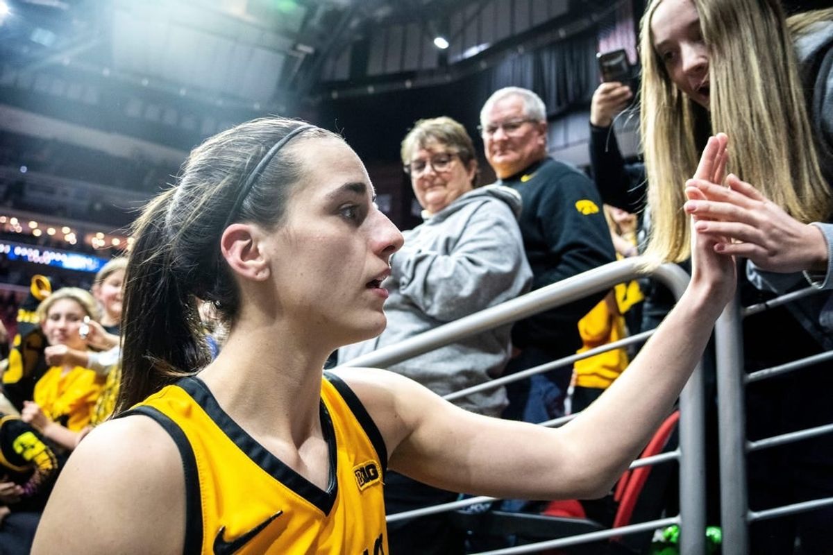 Iowa guard Caitlin Clark greets fans after defeating Cleveland State.