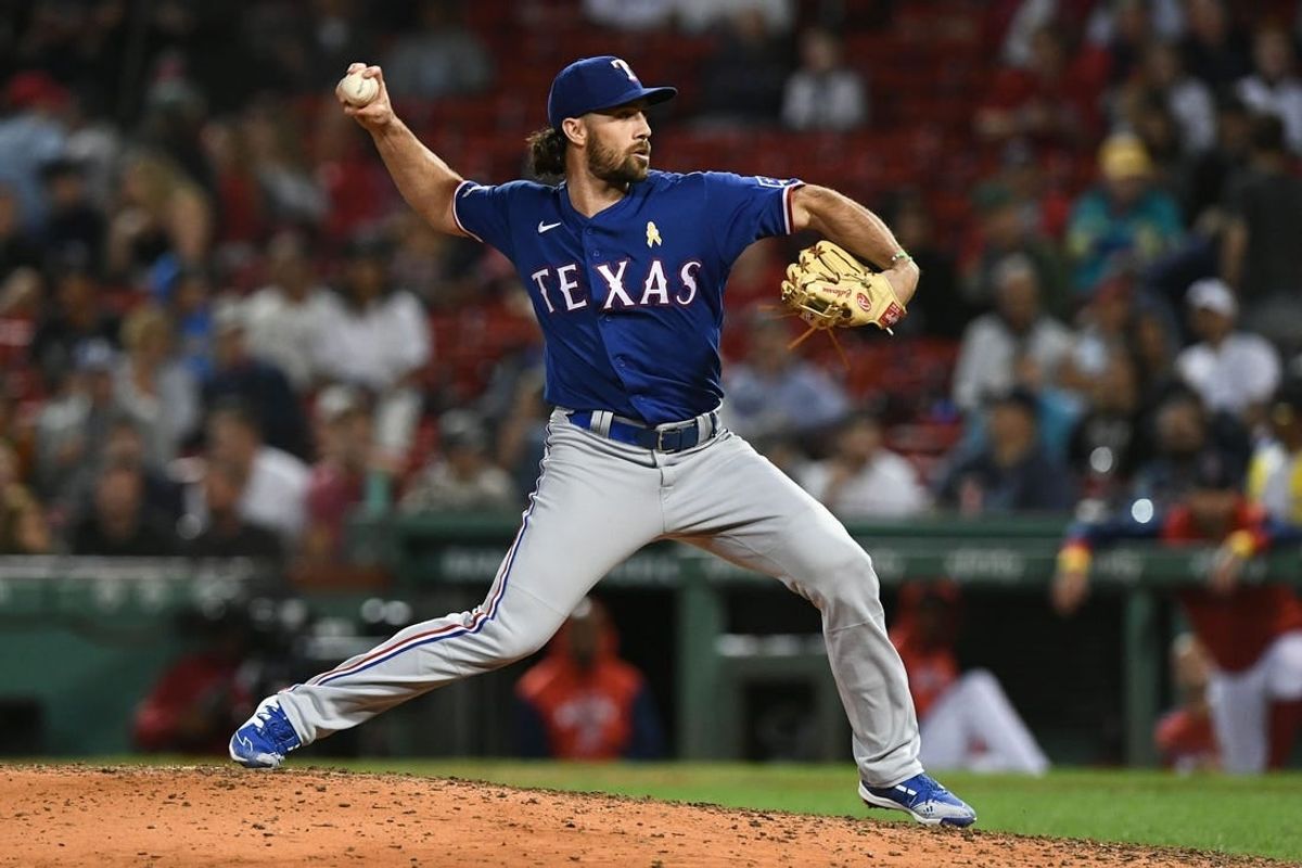 Sep 2, 2022; Boston, Massachusetts, USA; Texas Rangers third baseman Charlie Culberson (11) pitches against the Boston Red Sox during the eighth inning at Fenway Park.