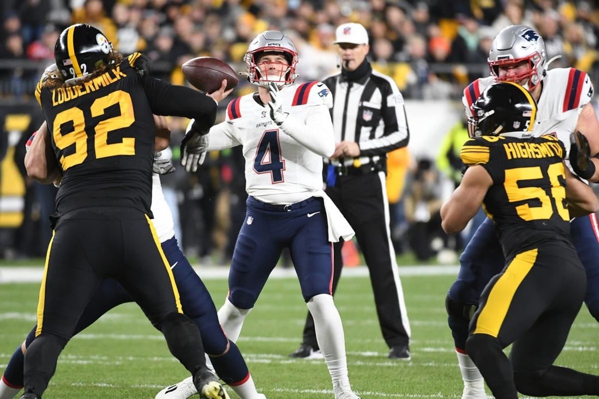 Dec 7, 2023; Pittsburgh, Pennsylvania, USA; New England Patriots quarterback Bailey Zappe (4) looks for a receiver against the Pittsburgh Steelers during the first quarter at Acrisure Stadium.