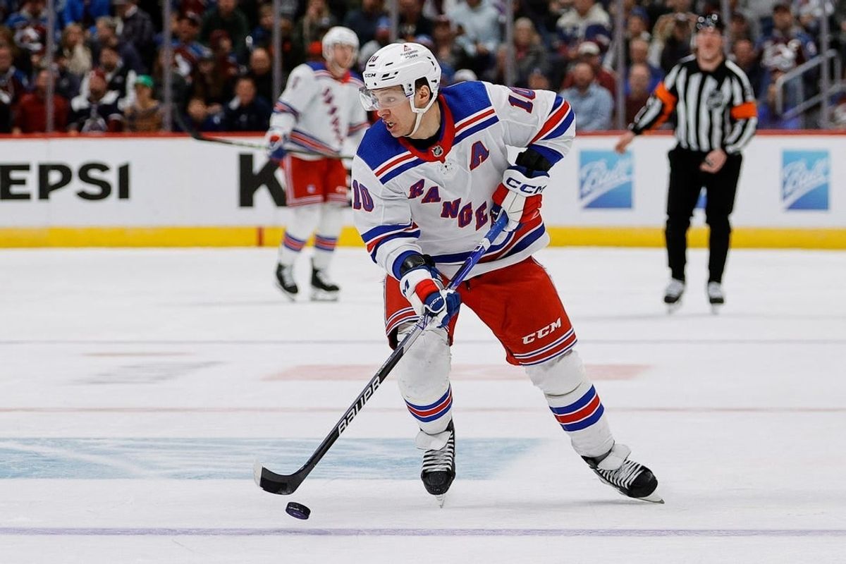 Mar 28, 2024; Denver, Colorado, USA; New York Rangers left wing Artemi Panarin (10) controls the puck in the third period against the Colorado Avalanche at Ball Arena.