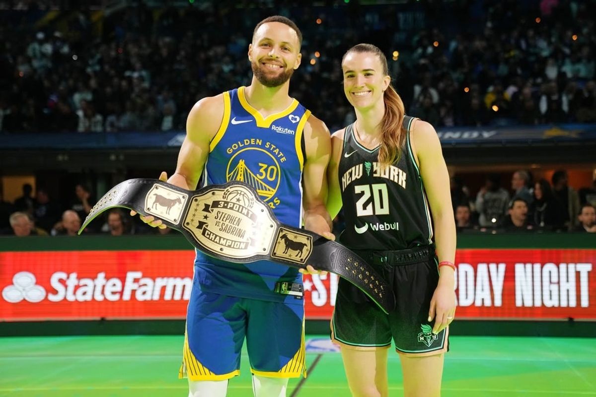 Feb 17, 2024; Indianapolis, IN, USA; Golden State Warriors guard Stephen Curry (30) and New York Liberty guard Sabrina Ionescu (20) after the Stephen vs Sebrina three-point challenge during NBA All Star Saturday Night at Lucas Oil Stadium.