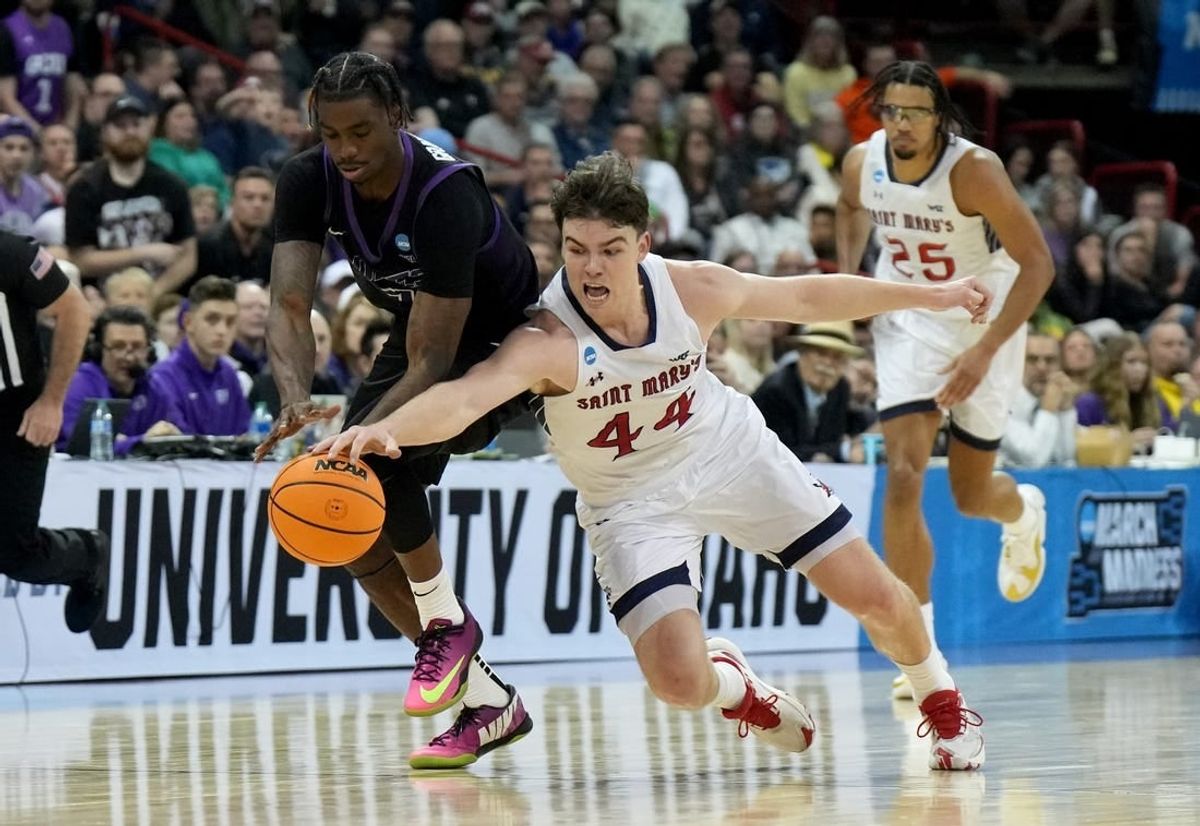 Mar 22, 2024; Spokane, WA, USA; Grand Canyon Antelopes guard Tyon Grant-Foster (7) and St. Mary's Gaels guard Alex Ducas (44) chase a loose ball during the first half in the first round of the 2024 NCAA Tournament at Spokane Veterans Memorial Arena.