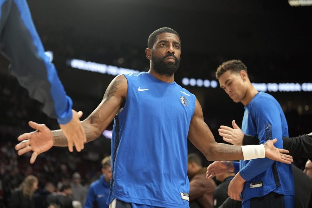 Dec 8, 2023; Portland, Oregon, USA; Dallas Mavericks point guard Kyrie Irving (11) is introduced as part of the starting lineup before the game against the Portland Trail Blazers at Moda Center.