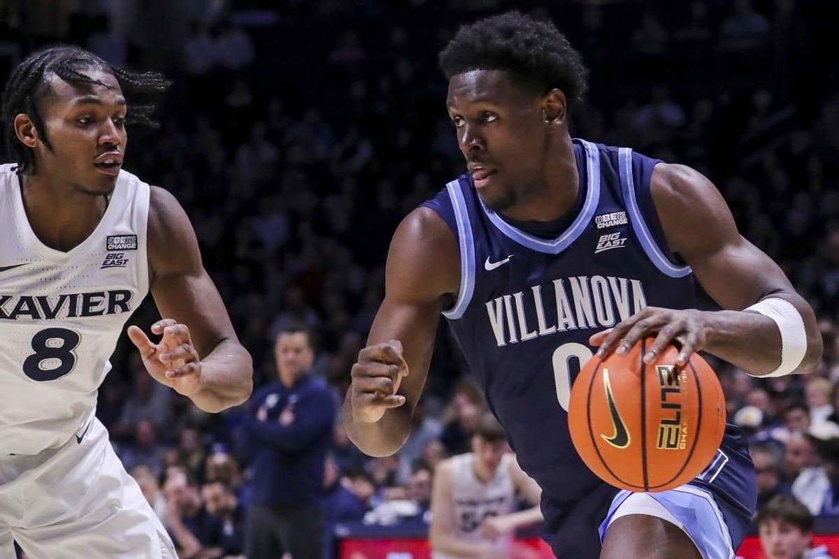 Feb 7, 2024; Cincinnati, Ohio, USA; Villanova Wildcats guard TJ Bamba (0) dribbles against Xavier Musketeers guard Quincy Olivari (8) in the second half at Cintas Center.