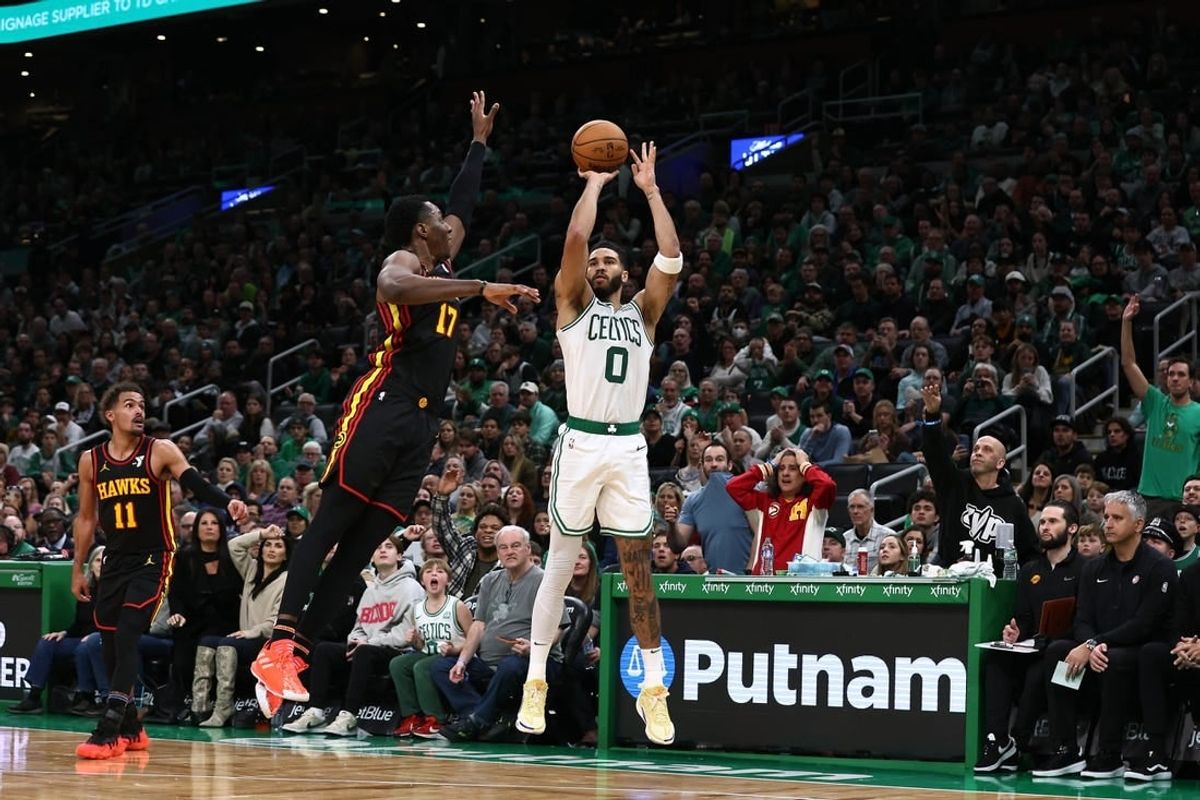 Nov 26, 2023; Boston, Massachusetts, USA; Boston Celtics forward Jayson Tatum (0) shoots against Atlanta Hawks forward Onyeka Okongwu (17) during the second half at TD Garden.