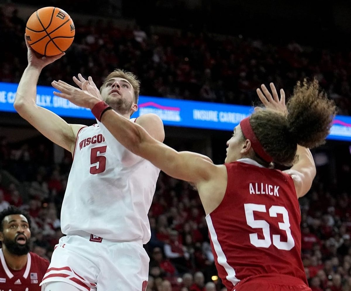 Jan 6, 2024; Madison, Wisconsin, USA; Wisconsin forward Tyler Wahl (5) scores on Nebraska forward Josiah Allick (53) during the second half  at Kohl Center.