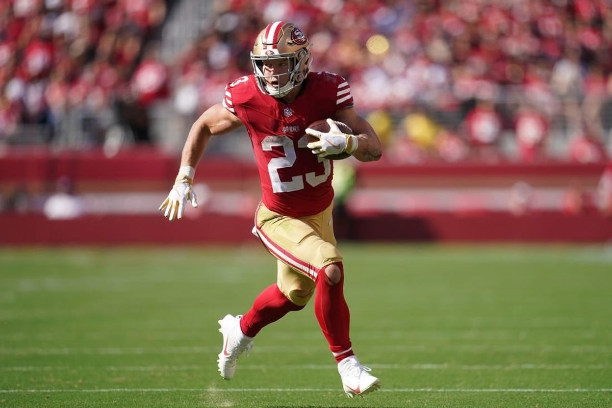 Oct 1, 2023; Santa Clara, California, USA; San Francisco 49ers running back Christian McCaffrey (23) runs the ball against the Arizona Cardinals in the third quarter at Levi's Stadium.