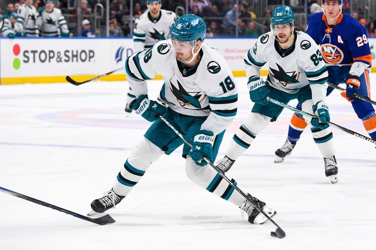 Dec 5, 2023; Elmont, New York, USA; San Jose Sharks right wing Filip Zadina (18) attempts a shot against the New York Islanders during the first period at UBS Arena.