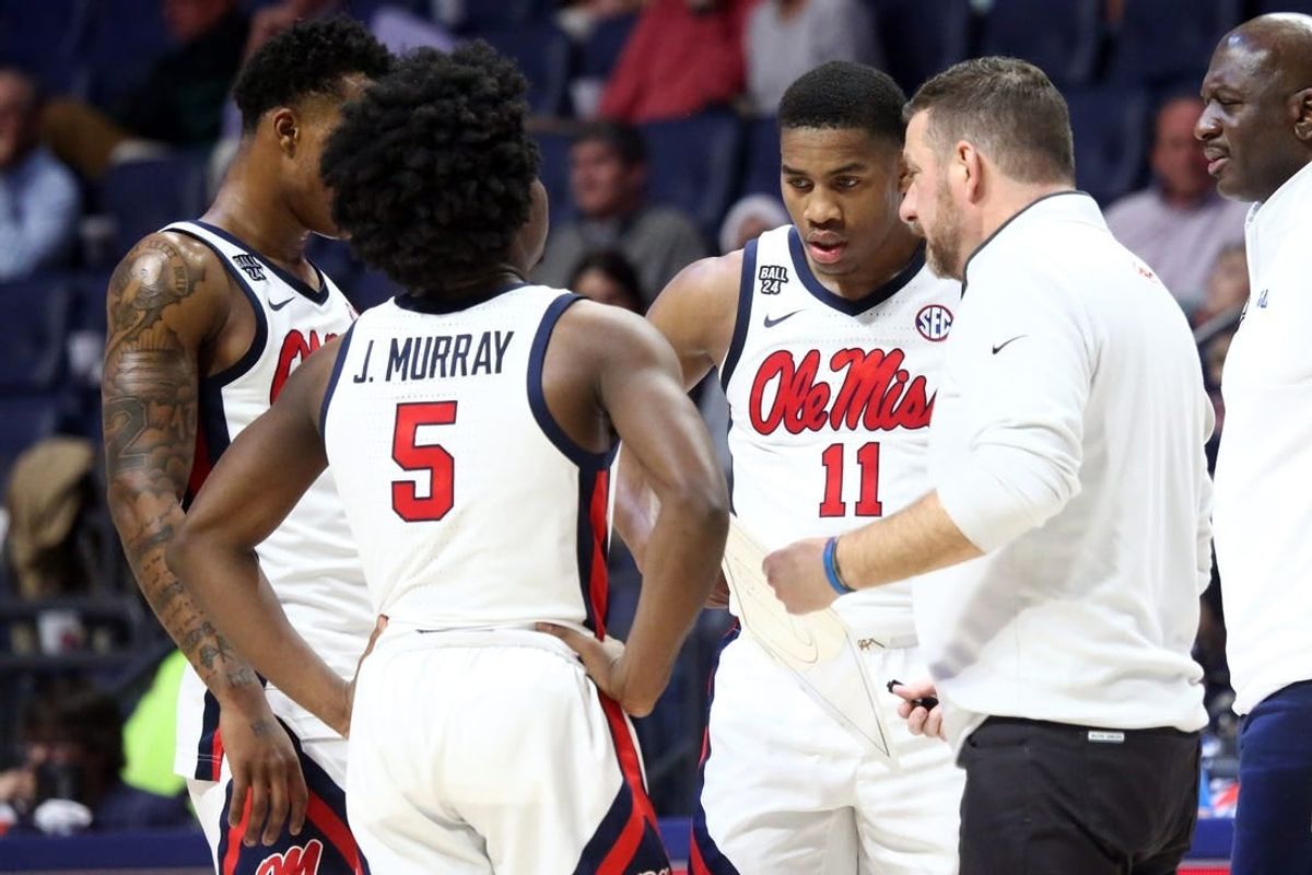 Dec 5, 2023; Oxford, Mississippi, USA; Mississippi Rebels guard TJ Caldwell (2), guard Jaylen Murray (5), guard Matthew Murrell (11) and head coach Chris Beard (right) huddle during a time out during the second half against the Mount St. Mary's Mountaineers at The Sandy and John Black Pavilion at Ole Miss.