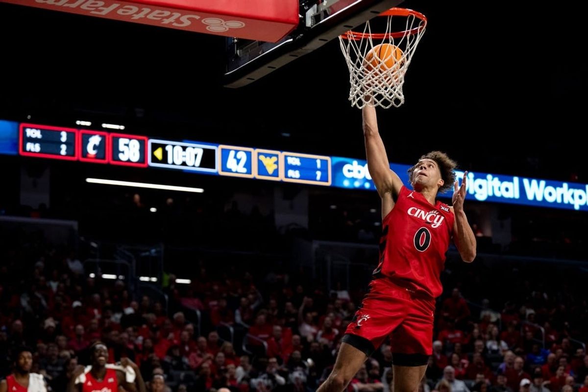 Cincinnati Bearcats guard Dan Skillings Jr. (0) goes up for an open dunk in the second half of the NCAA basketball game between Cincinnati Bearcats and West Virginia Mountaineers at Fifth Third Arena in Cincinnati on Saturday, March 9, 2024.