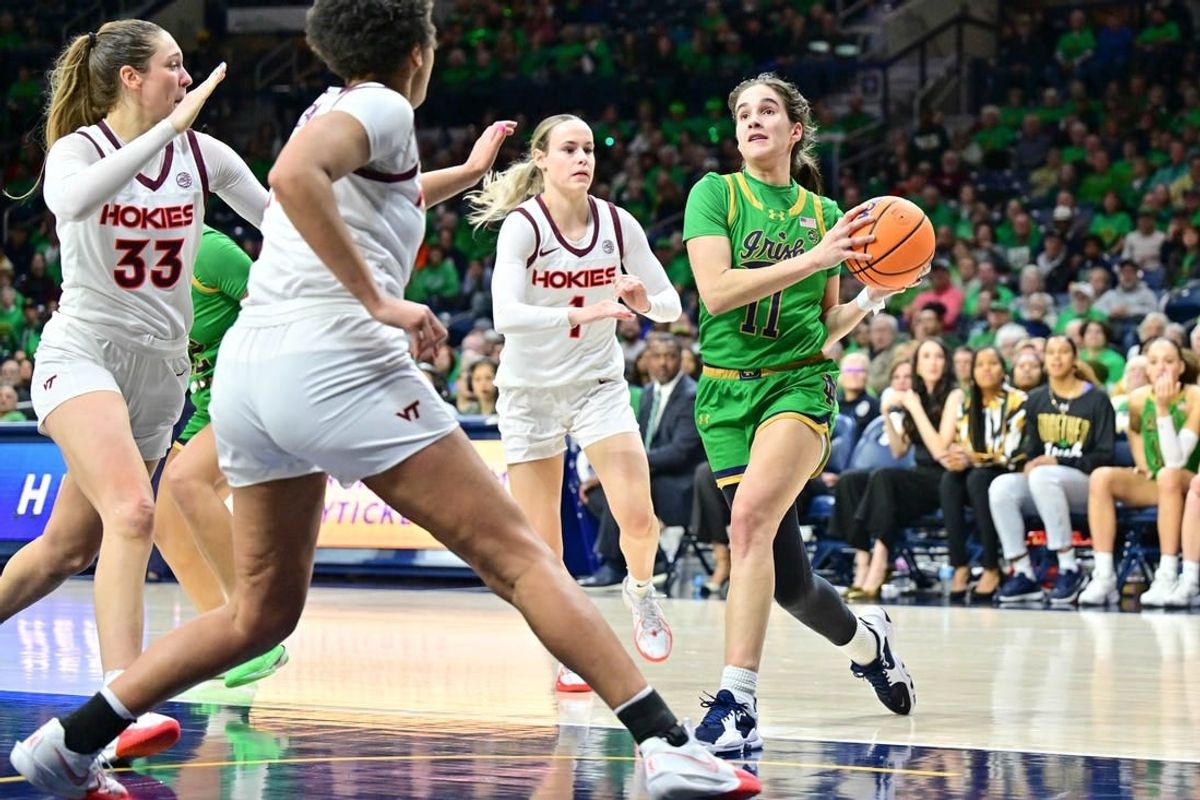 Feb 29, 2024; South Bend, Indiana, USA; Notre Dame Fighting Irish guard Sonia Citron (11) drives to the basket as Virginia Tech Hokies Carleigh Wenzel (1) defends in the second half at the Purcell Pavilion.