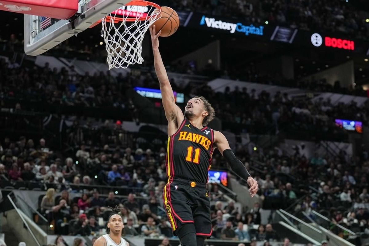 Nov 30, 2023; San Antonio, Texas, USA;  Atlanta Hawks guard Trae Young (11) lays the ball in during the second half against the San Antonio Spurs at the Frost Bank Center.