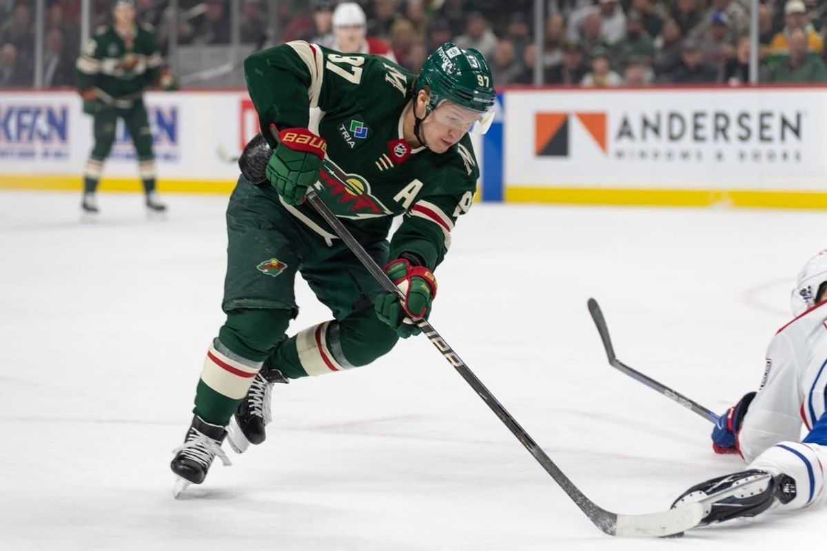 Dec 21, 2023; Saint Paul, Minnesota, USA; Minnesota Wild left wing Kirill Kaprizov (97) skates around a Montreal Canadiens player in the first period at Xcel Energy Center.