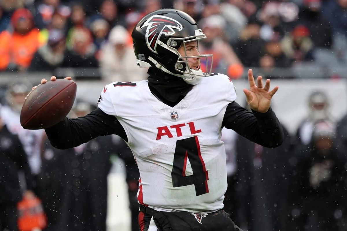 Dec 31, 2023; Chicago, Illinois, USA; Atlanta Falcons quarterback Taylor Heinicke (4) drops back to pass against the Chicago Bears during the first half at Soldier Field.