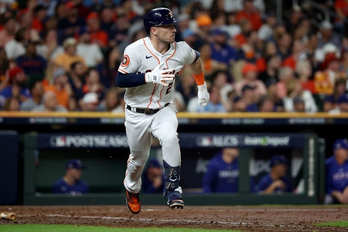 Oct 23, 2023; Houston, Texas, USA; Houston Astros third baseman Alex Bregman (2) doubles during the seventh inning of game seven in the ALCS against the Texas Rangers for the 2023 MLB playoffs at Minute Maid Park.