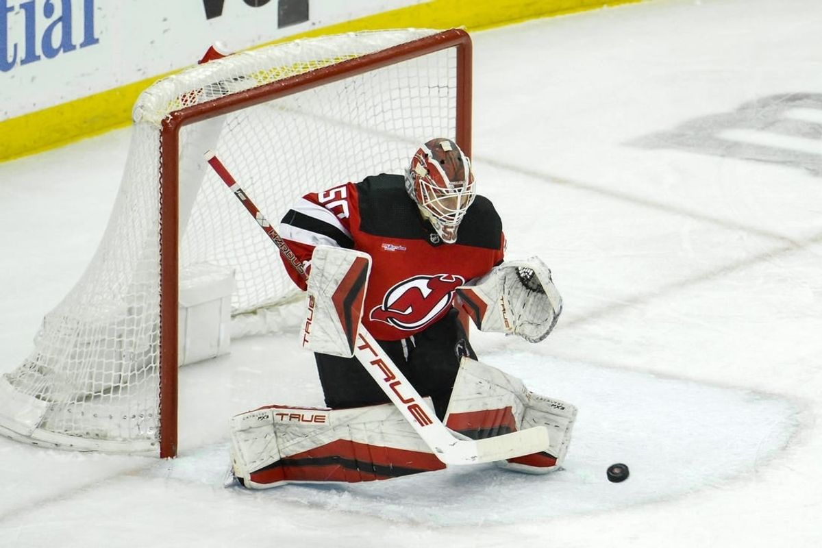 Feb 24, 2024; Newark, New Jersey, USA; New Jersey Devils goaltender Nico Daws (50) makes a save against the Montreal Canadiens during the third period at Prudential Center.
