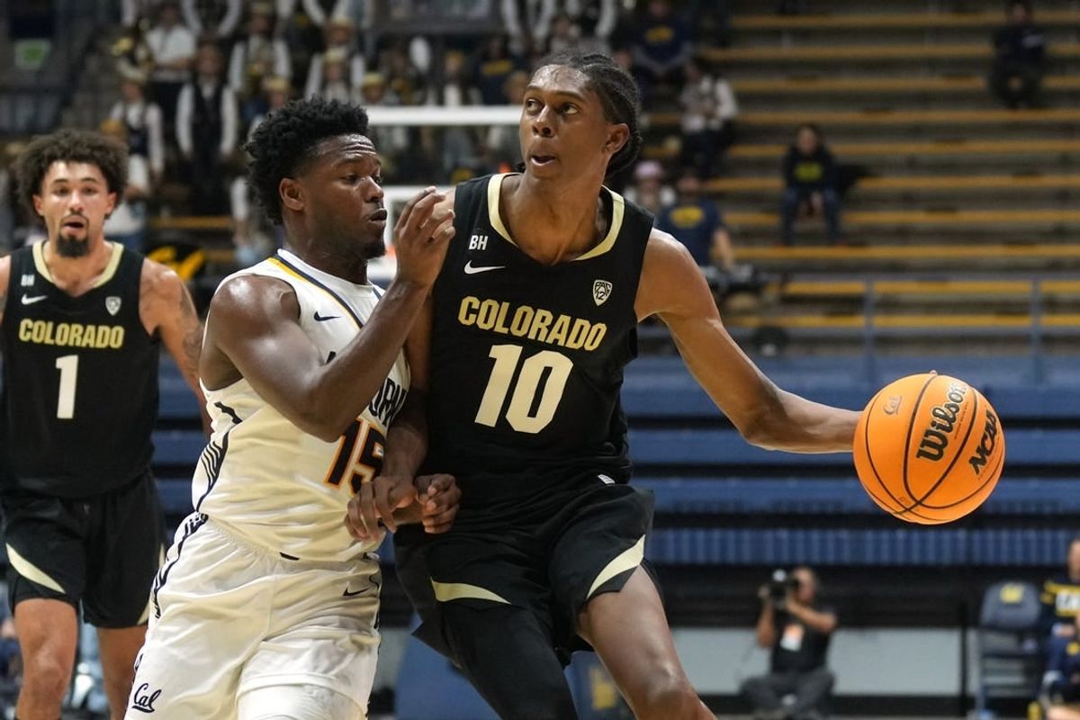 Jan 10, 2024; Berkeley, California, USA; Colorado Buffaloes forward Cody Williams (10) dribbles against California Golden Bears guard Jalen Cone (15) during the first half at Haas Pavilion.