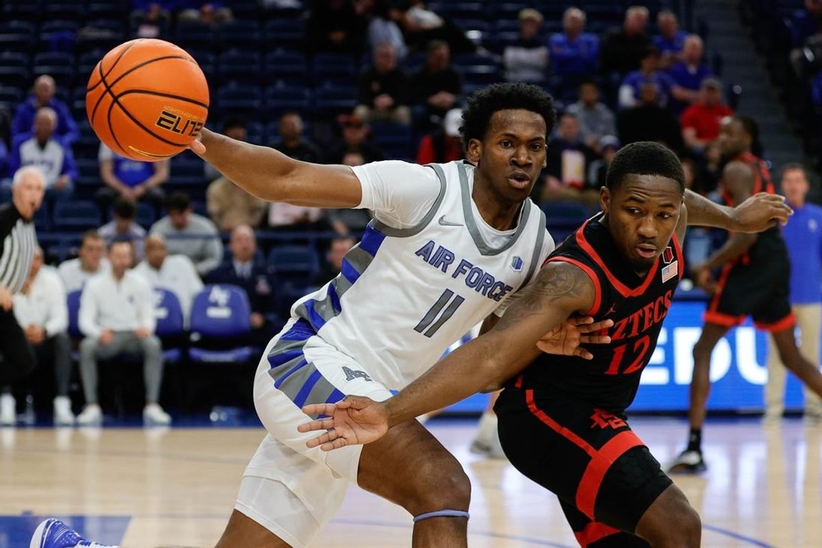 Feb 6, 2024; Colorado Springs, Colorado, USA; Air Force Falcons guard Byron Brown (11) and San Diego State Aztecs guard Darrion Trammell (12) battle for the ball in the first half at Clune Arena.