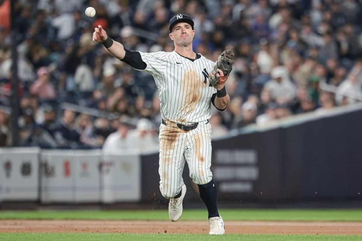 Apr 9, 2024; Bronx, New York, USA; New York Yankees third baseman Jon Berti (19) throws the ball to first base for an out during the fourth inning against the New York Yankees at Yankee Stadium.