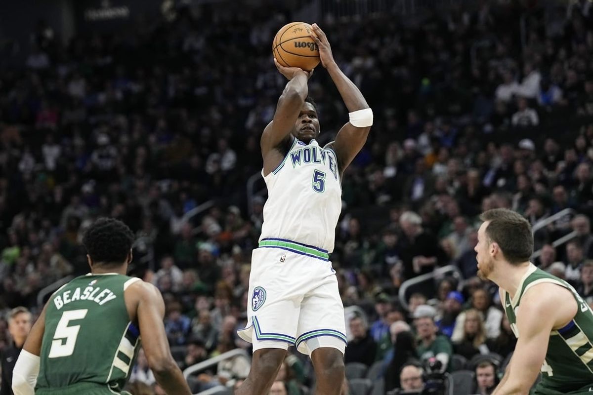 Feb 8, 2024; Milwaukee, Wisconsin, USA;  Minnesota Timberwolves guard Anthony Edwards (5) shoots during the second quarter against the Milwaukee Bucks at Fiserv Forum.