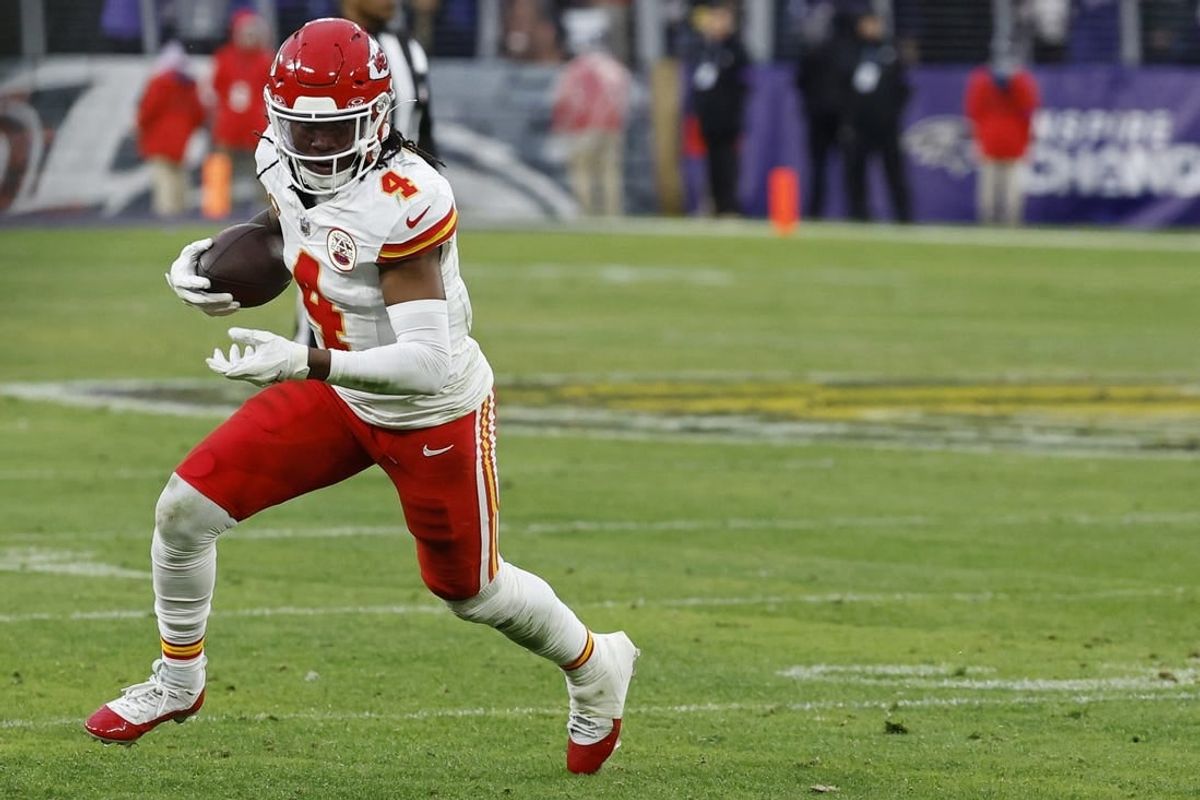 Jan 28, 2024; Baltimore, Maryland, USA; Kansas City Chiefs wide receiver Rashee Rice (4) carries the ball against the Baltimore Ravens in the AFC Championship football game at M&T Bank Stadium.