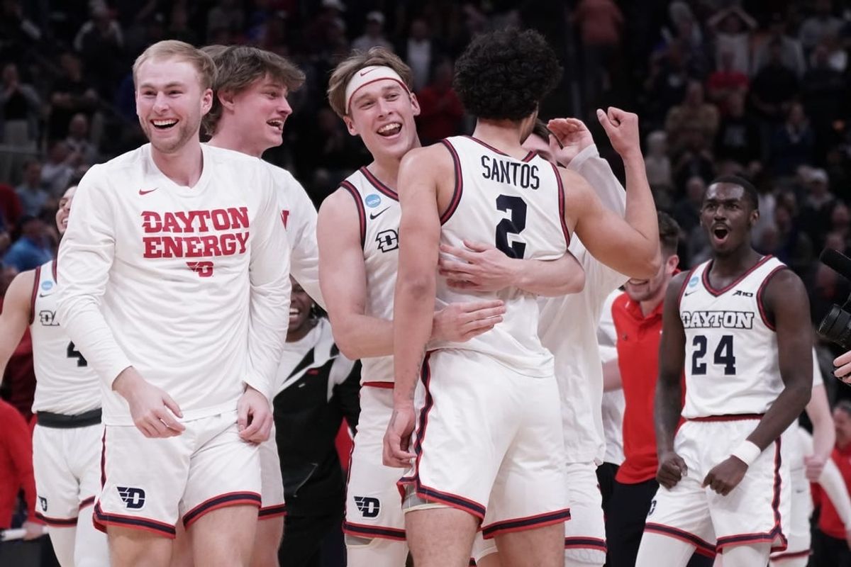 Mar 21, 2024; Salt Lake City, UT, USA; The Dayton Flyers celebrate the win against Nevada Wolf Pack after the second half in the first round of the 2024 NCAA Tournament at Vivint Smart Home Arena-Delta Center.