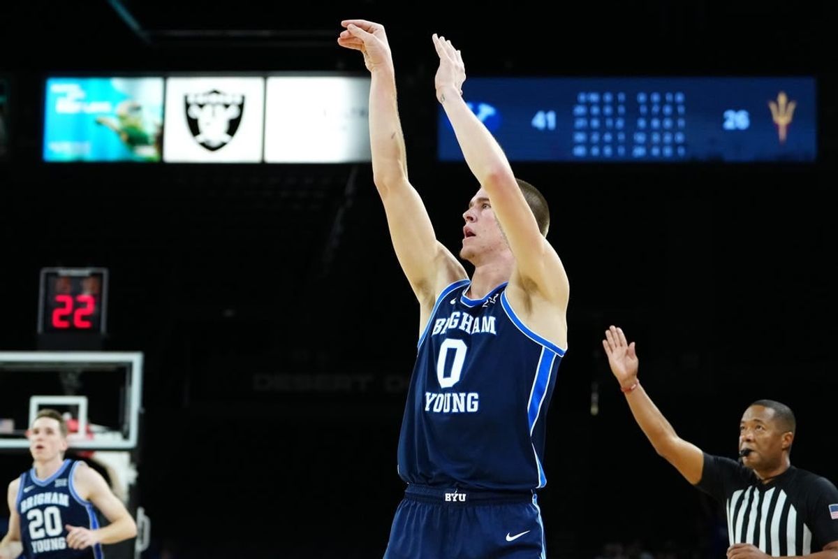 Nov 23, 2023; Las Vegas, Nevada, USA; Brigham Young Cougars forward Noah Waterman (0) shoots against the Arizona State Sun Devils during the second half at Michelob Ultra Arena.