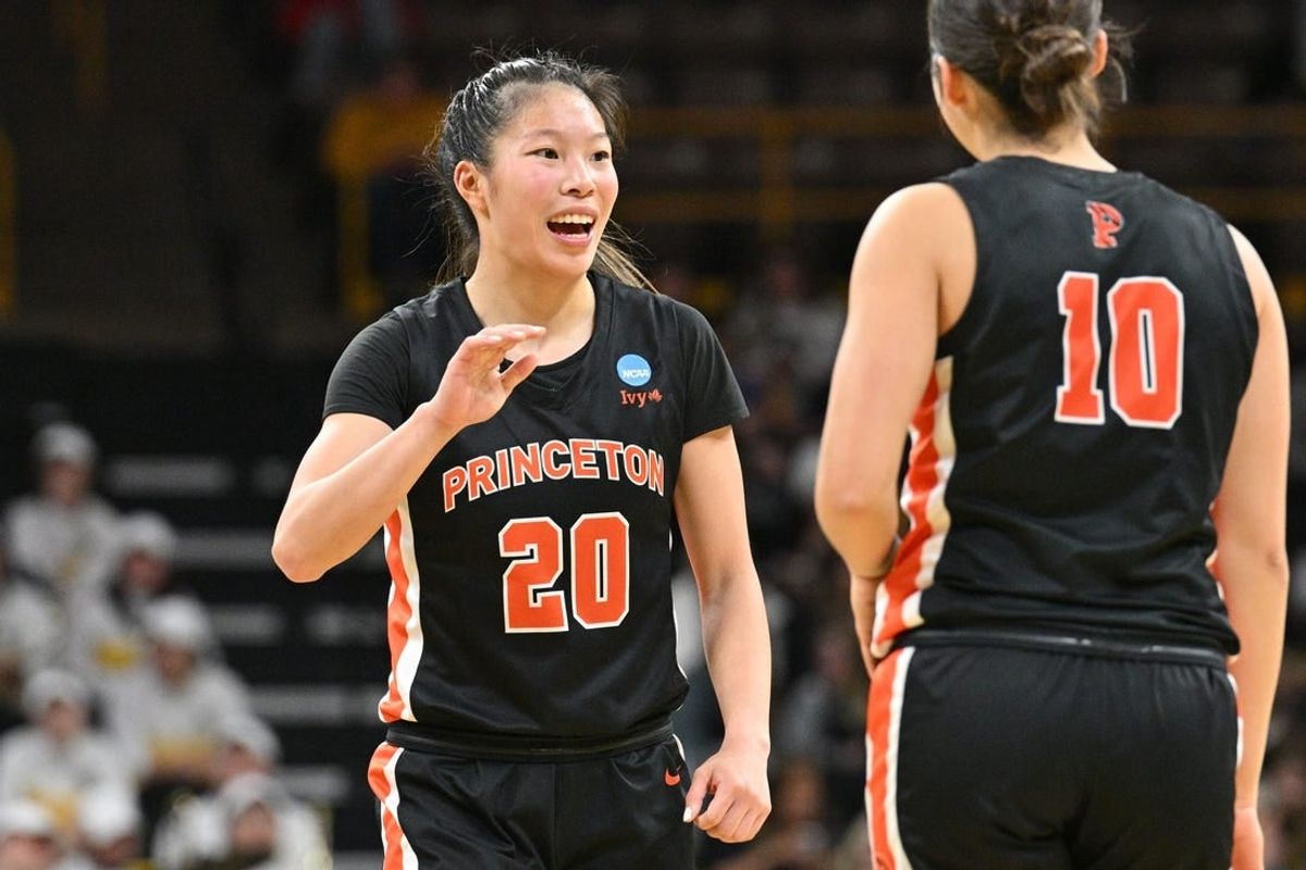 Mar 23, 2024; Iowa City, IA, USA; Princeton Tigers guard Kaitlyn Chen (20) reacts with guard Skye Belker (10) during second quarter against the West Virginia Mountaineers of the NCAA first round game at Carver-Hawkeye Arena.