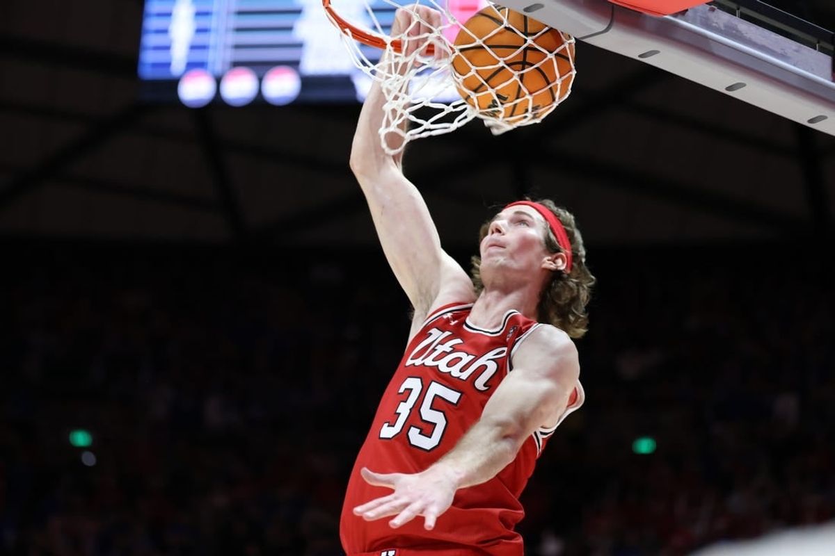 Dec 9, 2023; Salt Lake City, Utah, USA; Utah Utes center Branden Carlson (35) dunks the ball against the Brigham Young Cougars during the second half at Jon M. Huntsman Center.