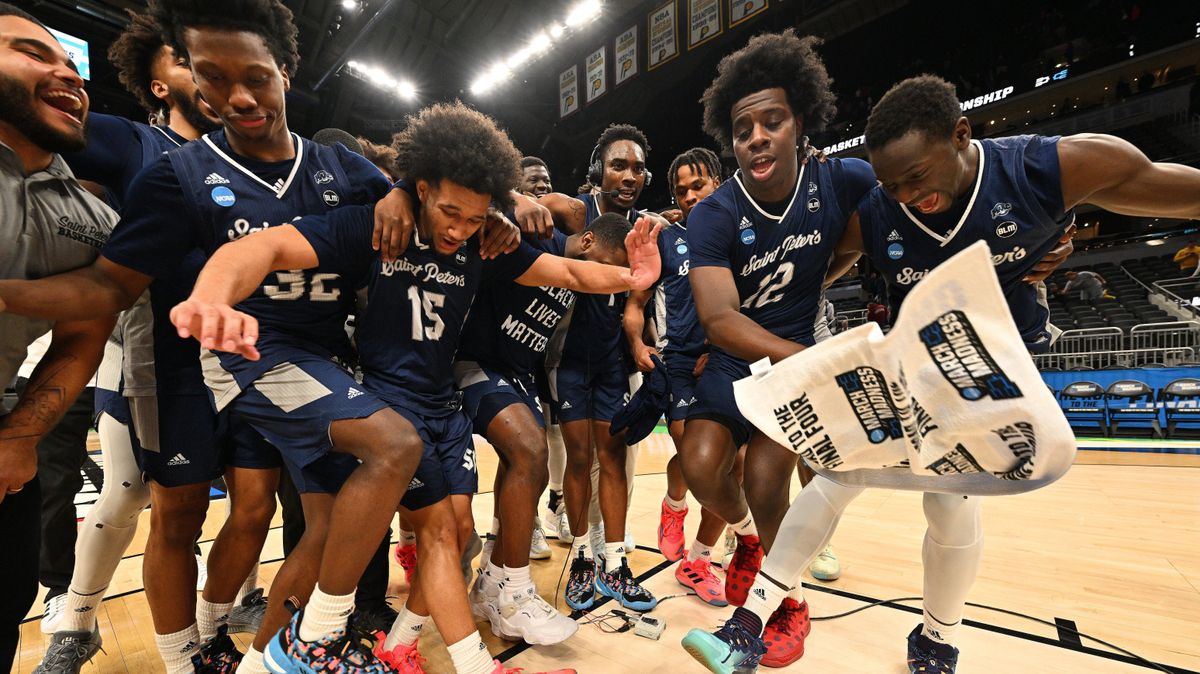 The unlikely contenders from St. Peter’s dance on the court after a win.