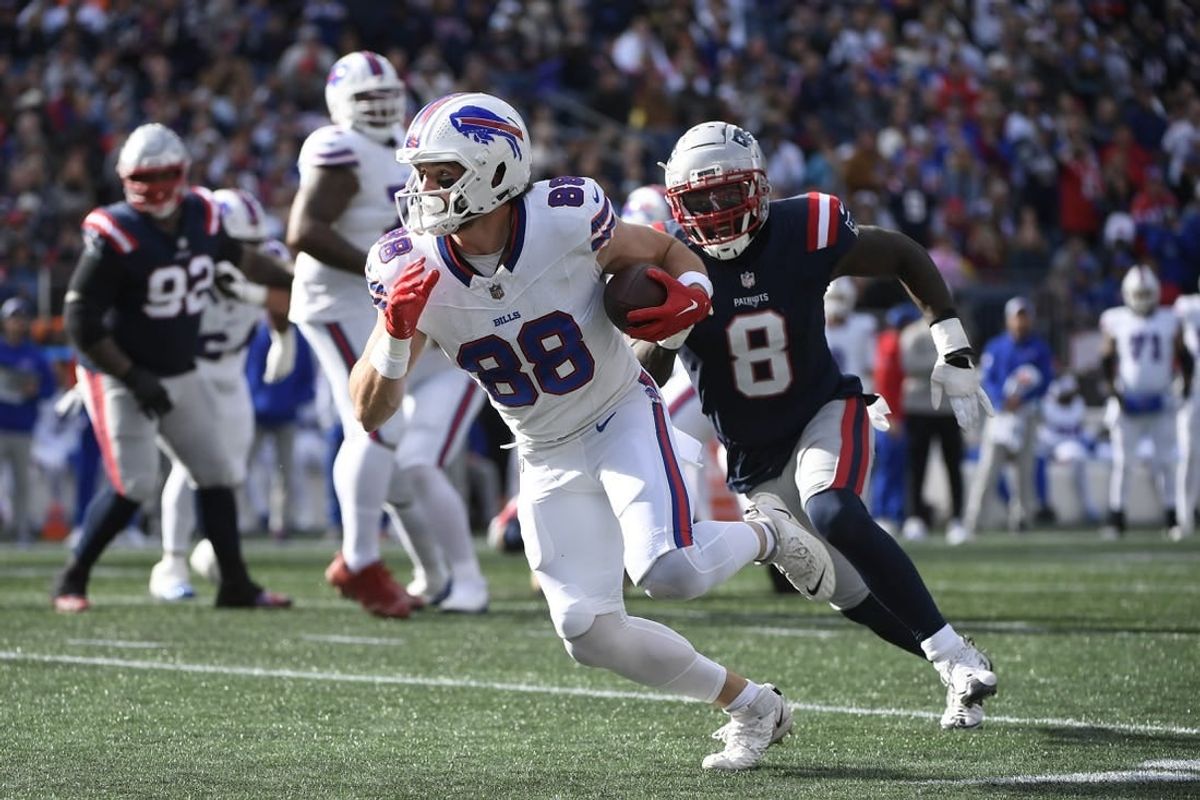 Oct 22, 2023; Foxborough, Massachusetts, USA; Buffalo Bills tight end Dawson Knox (88) runs the ball while New England Patriots linebacker Ja'Whaun Bentley (8) defends during the second half at Gillette Stadium.
