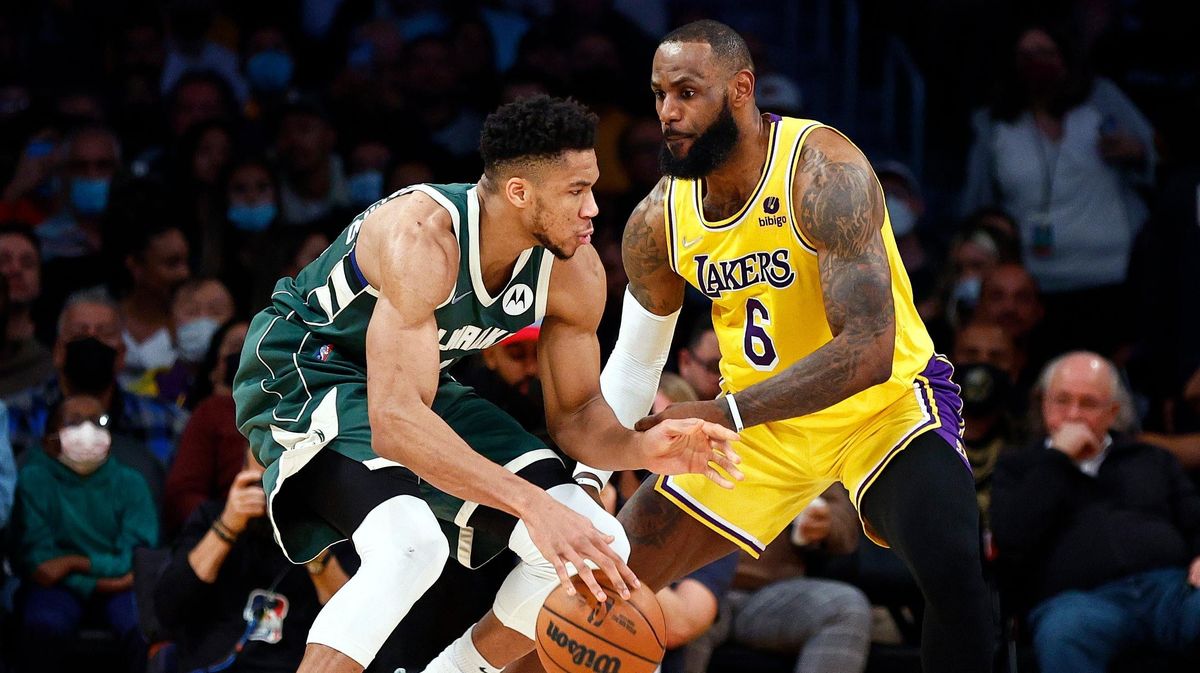 LeBron James guards Giannis Antetokounmpo.