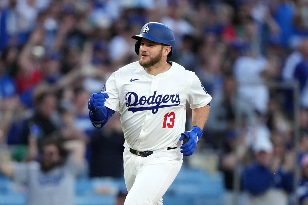 May 7, 2024; Los Angeles, California, USA; Los Angeles Dodgers third baseman Max Muncy (13) runs the bases after hitting a grand slam in the first inning against the Miami Marlins at Dodger Stadium.