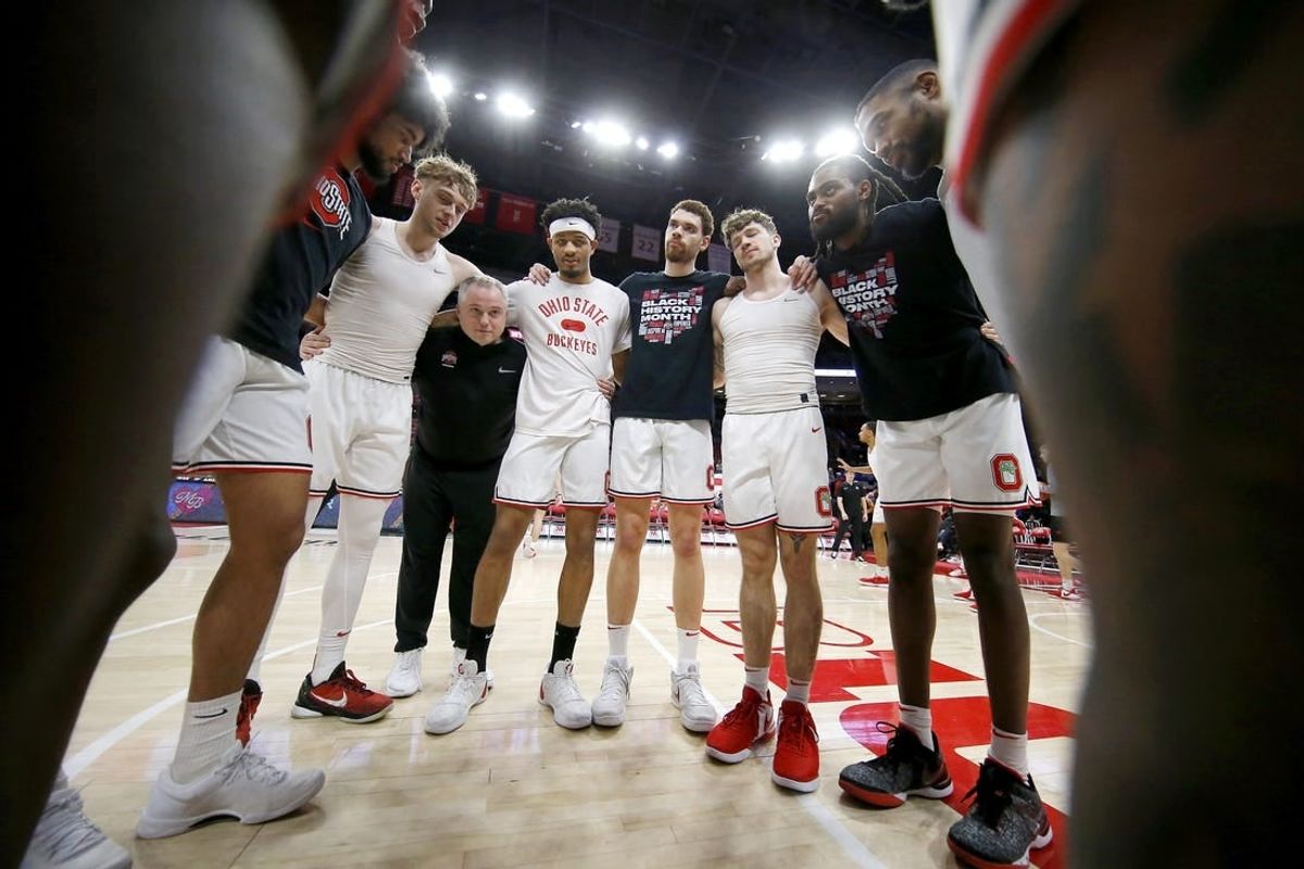 Feb 18, 2024; Columbus, Ohio, USA;  Ohio State Buckeyes guard Bowen Hardman (left) and guard Roddy Gayle Jr. (center) and forward Jamison Battle (center right) and guard Colby Baumann (42) huddle up before the game against the Purdue Boilermakers at Value City Arena.