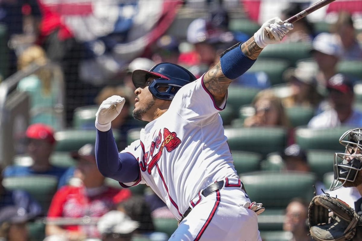 Apr 7, 2024; Cumberland, Georgia, USA; Atlanta Braves catcher Chadwick Tromp (45) hits a run scoring sacrifice fly ball against the Arizona Diamondbacks during the second inning at Truist Park.