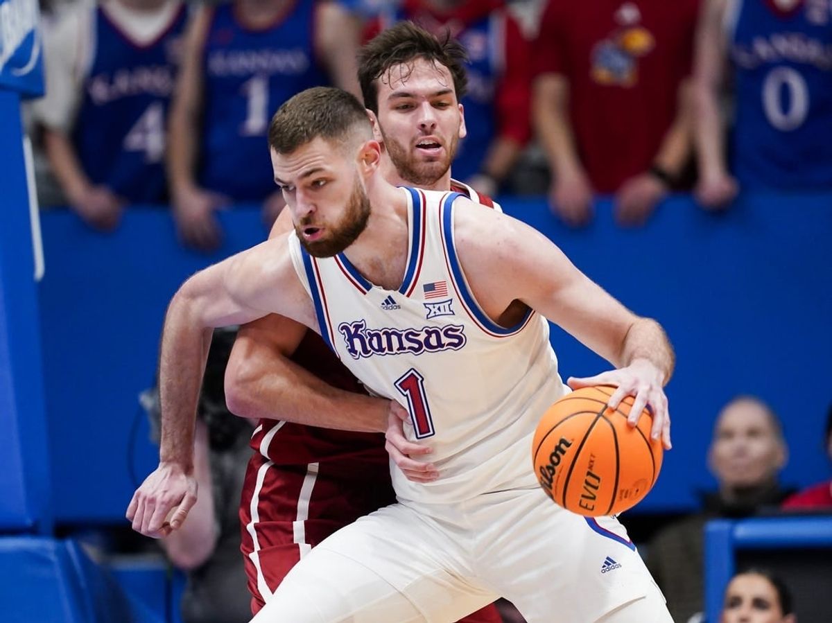 Jan 13, 2024; Lawrence, Kansas, USA; Kansas Jayhawks center Hunter Dickinson (1) drives against Oklahoma Sooners forward Sam Godwin (10) during the first half at Allen Fieldhouse.