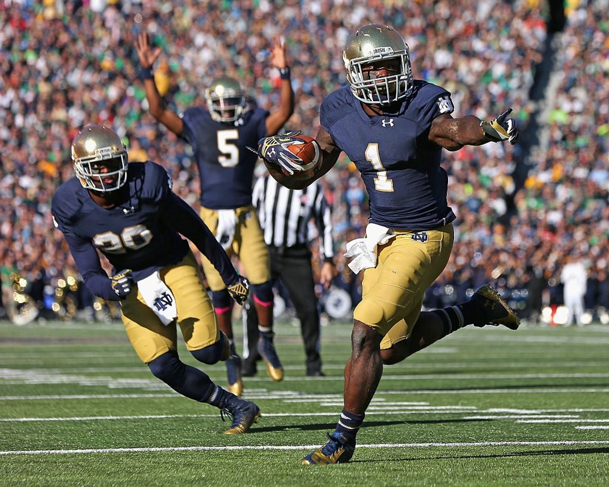 Greg Bryant runs for a touchdown in front of C.J. Prosise #20 as Evertt Golson #5 signals the score against the North Carolina Tar Heels at Notre Dame Stadium on October 11, 2014 in South Bend, Indiana. Via  [object Object] .