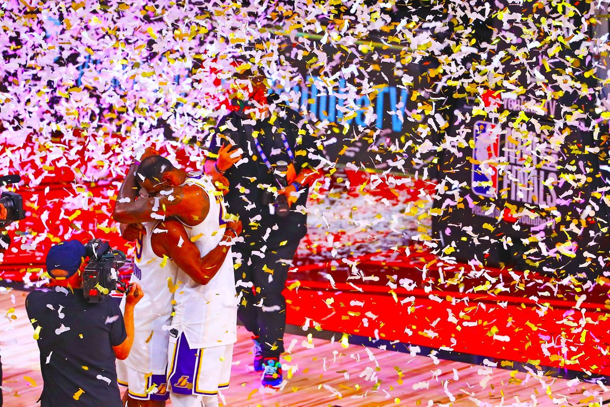 Lebron James embraces Rajon Rondo after Lakers win championship last night, James’ fourth and Rando’s second.