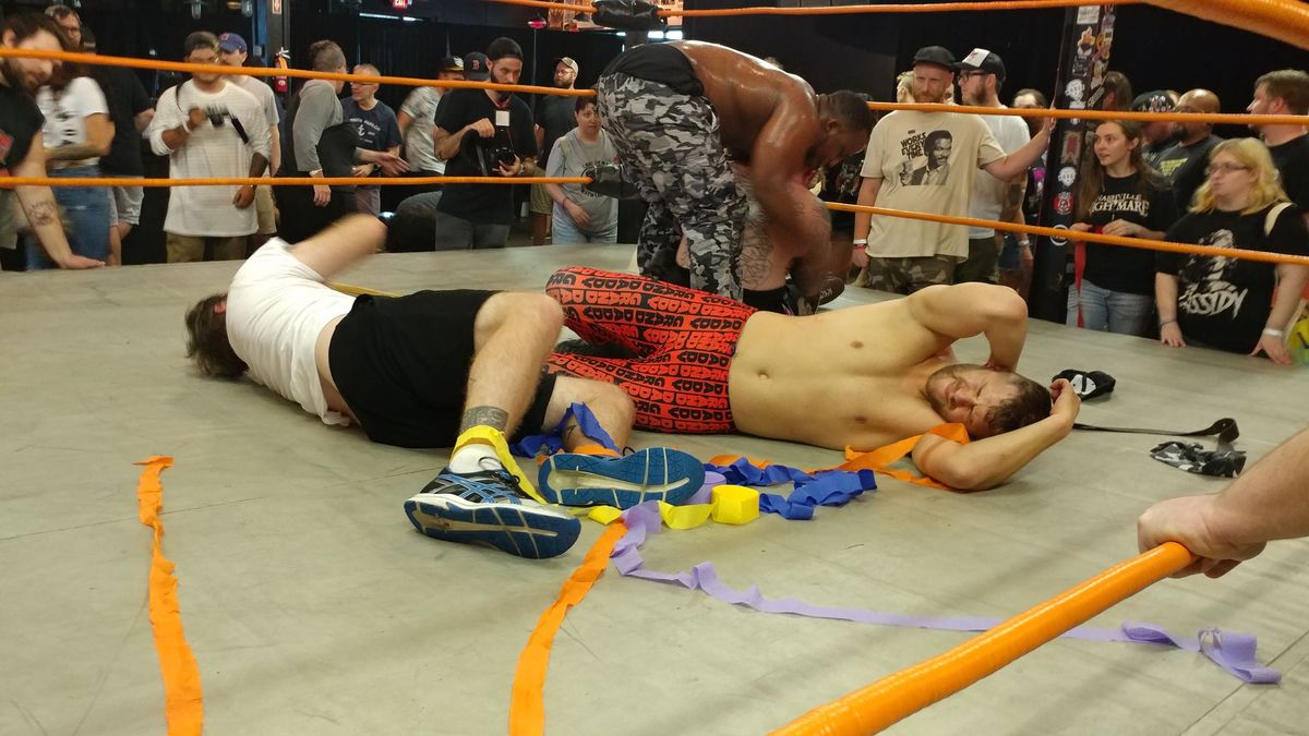 A.J. Gray tends to Kerry Awful as Dylan Hales and Nick Iggy recover from their beating at the hands of Curt Stallion, O’Shay Edwards, and Brett Ison.