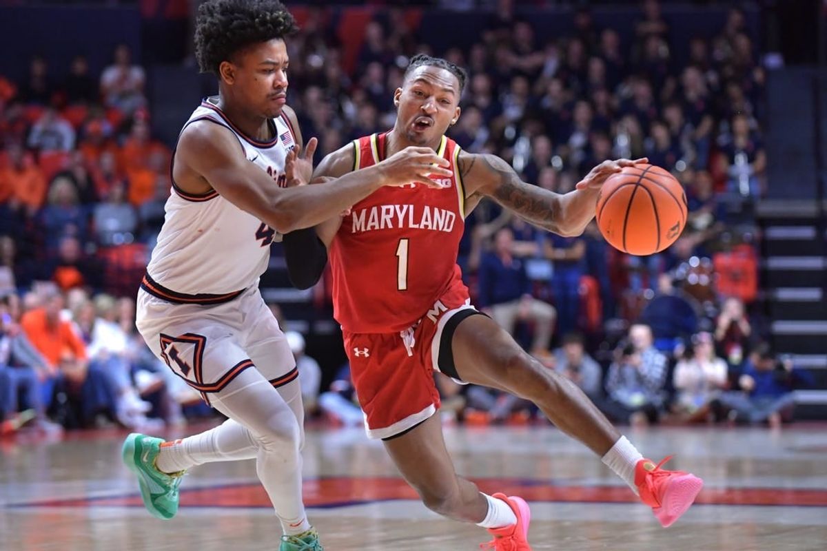 Jan 14, 2024; Champaign, Illinois, USA;  Maryland Terrapins guard Jahmir Young (1) drives the ball against Maryland Terrapins center Braden Pierce (4) during the second half at State Farm Center.