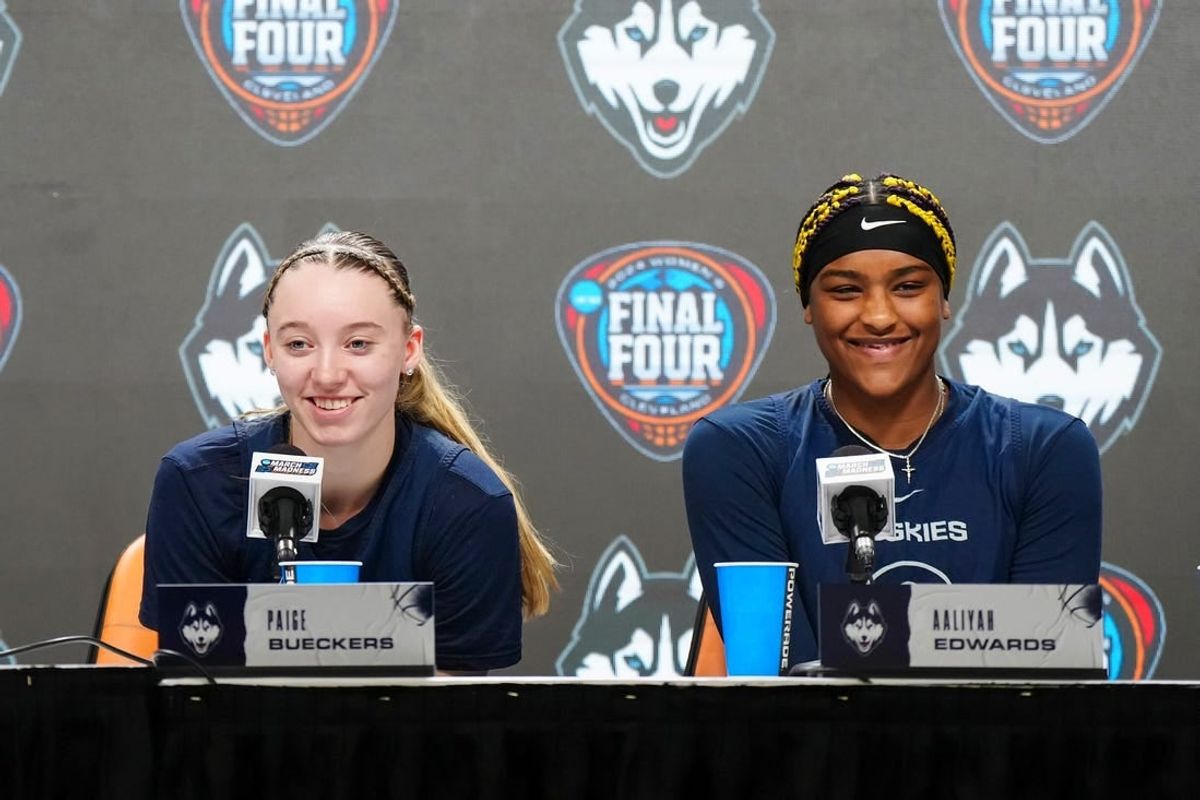 Apr 4, 2024; Cleveland, OH, USA; UConn Huskies coach Geno Auriemma (left), guard Paige Bueckers (center) and forward Aaliyah Edwards during press conference at Rocket Mortgage FieldHouse.