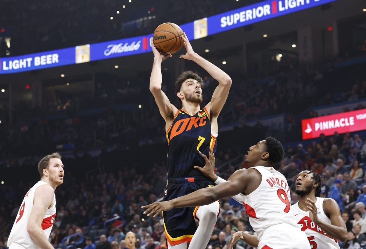 Feb 4, 2024; Oklahoma City, Oklahoma, USA; Oklahoma City Thunder forward Chet Holmgren (7) shoots against Toronto Raptors guard RJ Barrett (9) during the first quarter at Paycom Center.