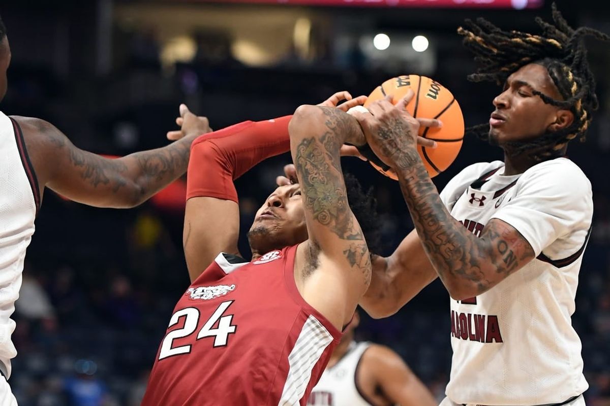 Mar 14, 2024; Nashville, TN, USA; Arkansas Razorbacks guard Jeremiah Davenport (24) tries to grab a rebound against South Carolina Gamecocks guard Zachary Davis (12) during the first half at Bridgestone Arena.