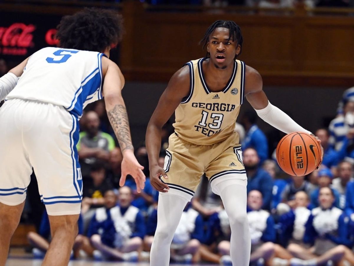 Jan 13, 2024; Durham, North Carolina, USA; Georgia Tech Yellow Jackets guard Miles Kelly (13) controls the ball against Duke Blue Devils guard Tyrese Proctor (5) during the first half at Cameron Indoor Stadium.
