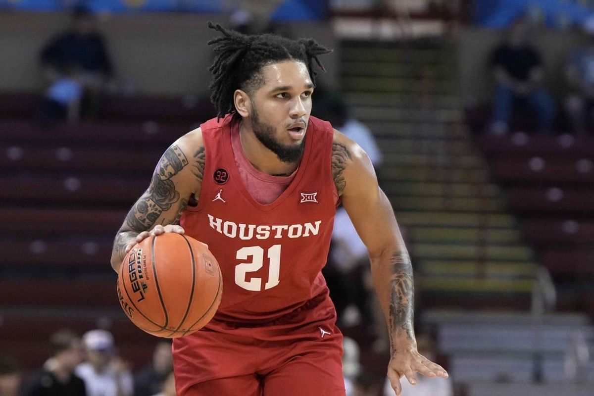 Nov 17, 2023; Charleston, SC, USA; Houston Cougars guard Emanuel Sharp (21) brings the ball up court in the first half against the Utah Utes at TD Arena.